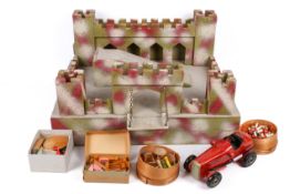 A vintage wooden toy fort / castle with a wooden car.