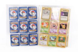 An album of approximately 100 assorted Pokemon trading cards, to include first editions.