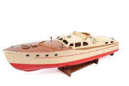 A circa 1960s Clyde Kits wooden model cabin cruiser 'Norvic' with an electric motor.
