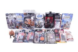 A collection of assorted Star Wars action figures, mostly carded. Including Darth Maul, R2-D2, etc.