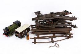 A vintage Hornby O gauge clockwork tin plate train set with track.