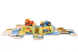 Two Matchbox diecast tractors and a collection of Matchbox Models of Yesteryear empty boxes.