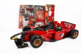 A Hasbro Action Man Grand Prix Driver, boxed, with racing car and kit.
