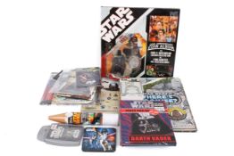 A group of assorted Star Wars collectables. Including games, books and Darth Vader figure, etc.