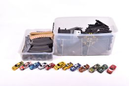 A collection of assorted modern Scalextric slot cars and a large quantity of track.