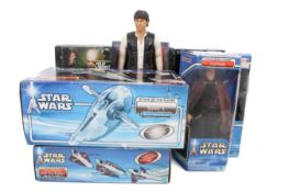 A collection of Star Wars related large action figures with two Hasbro space ships, all boxed.