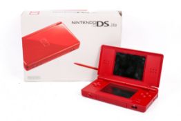 A Nintendo DS Lite (red) hand held game console, boxed (af).