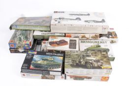 A collection of assorted plastic model makers kits, mostly military vehicles.