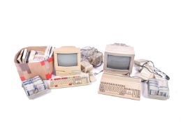 Amiga and commodore computers with manuals and disks.