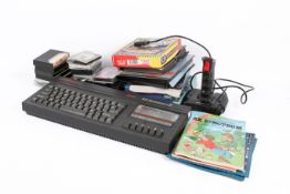 A Sinclair 128K ZX Spectrum + 2A home personal computer with games and accessories.