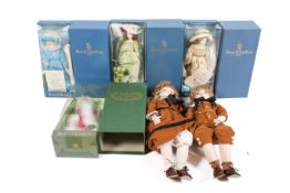 A collection of six assorted porcelain dolls, boxed.