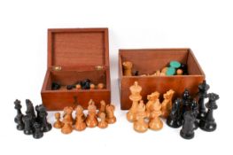 Two sets of 20th century wooden chess pieces.