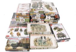 A collection of assorted plastic model maker's kits, mostly soldiers, all boxed.