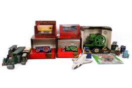 A collection of assorted vintage diecast and tin plate model steam related vehicles.