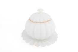 A 20th century lidded glass punch bowl of pumpkin type form on scalloped edge plate.