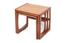 A mid-20th century G-Plan ' Quadrille' nest of three tables.
