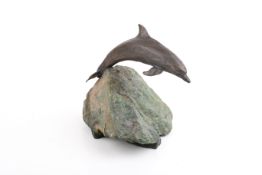 Grace Critchley (British), 20th entury bronze dolphin mounted on stone base.