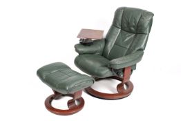 A Stressless reclining swivel base armchair and matching foot stool, upholstered in green hide.