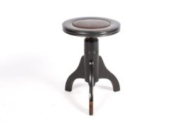 A 20th century ebonised wood stool.