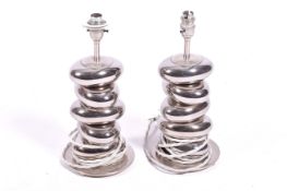 A pair of contemporary Valdemar dos Santos stacked metal pebble table lamps.