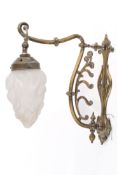A 20th century Art Deco brass scroll wall light with torch shade. No cracks or chips to shade.