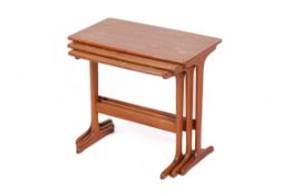 A mid-century, Danish style teak nest of table. Three graduating tables connected via runners.