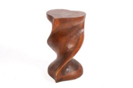 A 20th centuy solid hardwood stool with heart shaped top sat on twisted column,