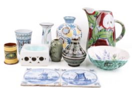 A collection of glazed, ceramic pottery items.