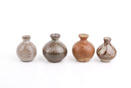 David Leach (British, 1911-2005), Four mid-20th century studio pottery stoneware bud vases.