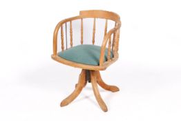 A 20th century pine captain's chair.