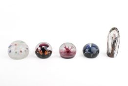 Five Caithness and Strathearn paperweights.