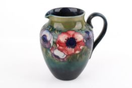 A 20th century Walter Moorcroft jug of rounded form.