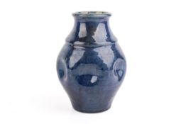 A vintage blue glazed studio pottery vase.