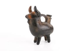 A mid-century ceramic jug in the form of a bull. Brown and black glazed. Unsigned.