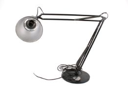 A large mid-century black anglepoise lamp on weighted circular base. Circa 93cm high.