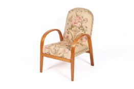A 20th century, Art Deco bentwood armchair. Beech frame with floral upholstered backrest and seat.