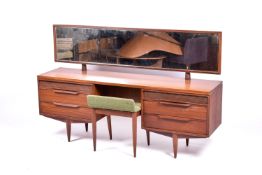 A mid-century White & Newton afromosia teak dressing table with mirror and upholstered stool.