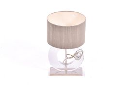 A contemporary Porta Romana clear perspex table lamp. Raised on a rectangular metal base.