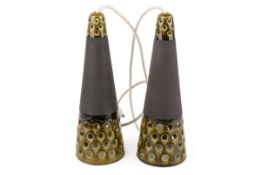 A pair of vintage Danish studio pottery table lamps. Perforated and green glazed shades.