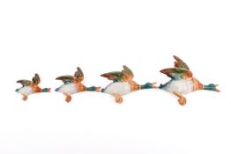 A set of four vintage flying Beswick ducks, individually numbered 596-1, 596-2,596-3 and 596-4.