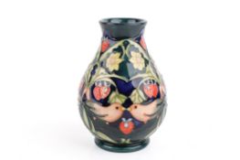 A 20th century Walter Moorcroft strawberry thief vase.