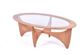 A mid-20th century G-Plan axe leg coffee table with glass top.