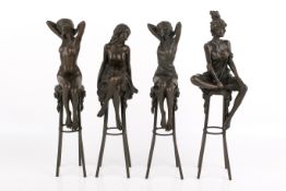 After Pierre Collinet, four bronze female figures modelling on stools.