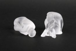 Two small Lalique frosted glass models of crouching figures.