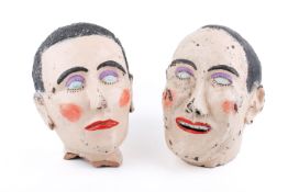 A pair of vintage earthenware sculpted French style female busts.