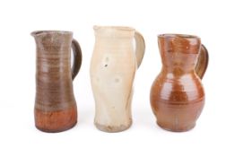 A collection of three mid-century Danish studio pottery jugs.