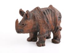 A 20th century red earthenware sculpture of a rhino.