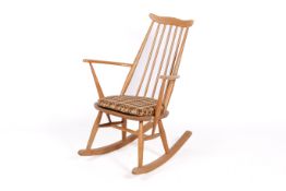 A mid-century Ercol Goldsmiths, beech and elm rocking chair.