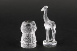 Two small Lalique glass models in the form of a giraffe and a wine bottle cork.