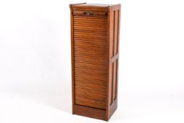 A 20th century oak roll-top filing cabinet.